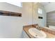 Bathroom features white vanity, wood-look tile, and modern fixtures at 5420 River Sound Ter, Bradenton, FL 34208