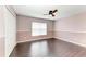 Bedroom with hardwood floors, closet and ceiling fan at 5420 River Sound Ter, Bradenton, FL 34208