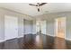 This spacious bedroom has hardwood floors, a ceiling fan, and an en suite bath at 5420 River Sound Ter, Bradenton, FL 34208