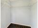 The closet features white wire shelves and dark, wood-look flooring at 5420 River Sound Ter, Bradenton, FL 34208
