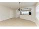 Dining area with chandelier, adjacent to the kitchen, perfect for entertaining at 5420 River Sound Ter, Bradenton, FL 34208