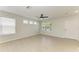 Open living room with large windows and tile flooring at 5420 River Sound Ter, Bradenton, FL 34208