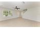 Bright living room with neutral walls, tile floors, and a ceiling fan at 5420 River Sound Ter, Bradenton, FL 34208