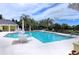 Beautiful community pool with ample seating and well maintained landscaping around the pool at 5420 River Sound Ter, Bradenton, FL 34208