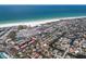 Wide aerial shot of a waterfront community, showcasing beach access, diverse housing, and recreational facilities at 5581 Shadow Lawn Dr, Sarasota, FL 34242