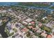 Aerial view features waterfront homes with docks, winding streets, mature trees, and river views at 5581 Shadow Lawn Dr, Sarasota, FL 34242
