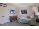 Bright bedroom with a chandelier, a TV and a window providing natural light at 5581 Shadow Lawn Dr, Sarasota, FL 34242