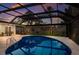 Enjoy this screened in pool with travertine tile, spacious lawn, and backyard access from the main home at 5581 Shadow Lawn Dr, Sarasota, FL 34242