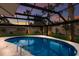 Sparkling pool is surrounded by a screened enclosure, providing a private and serene outdoor retreat for relaxation and recreation at 5581 Shadow Lawn Dr, Sarasota, FL 34242