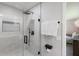 Modern shower with black fixtures, a glass door, and a spa-like feel at 5581 Shadow Lawn Dr, Sarasota, FL 34242