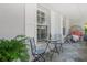 Cozy front porch with comfortable seating and stylish decor and large window at 572 Commonwealth Ln, Sarasota, FL 34242