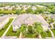 Spacious condo with well manicured lawn and mature landscaping, surrounded by neighboring homes in a serene community at 600 Mirabella Cir # 201, Venice, FL 34292