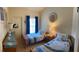 This bedroom features twin beds with matching bedding, offering a cozy and inviting space at 600 Mirabella Cir # 201, Venice, FL 34292