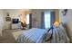 This cozy bedroom features a serene space and a nautical themed decor, offering a peaceful retreat at 600 Mirabella Cir # 201, Venice, FL 34292