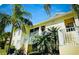 Charming condo with lush landscaping, including palm trees and well-maintained gardens in a desirable community at 600 Mirabella Cir # 201, Venice, FL 34292
