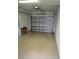 Clean and organized garage with an automatic door, offering ample space for parking and storage at 600 Mirabella Cir # 201, Venice, FL 34292