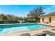 Enjoy the community pool surrounded by lush landscaping, perfect for relaxation and recreation at 600 Mirabella Cir # 201, Venice, FL 34292