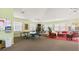 Spacious recreation room featuring ping pong table, fitness equipment, and lounge area for relaxation and entertainment at 600 Mirabella Cir # 201, Venice, FL 34292