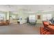 Bright rec room offering flexible space for games, exercise, and lounging with ample seating at 600 Mirabella Cir # 201, Venice, FL 34292