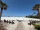 Easy beach access with benches, perfect for enjoying the ocean view at 6006 Midnight Pass Rd # 48, Sarasota, FL 34242