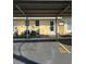 Exterior shot featuring covered parking and well-maintained landscaping at 6006 Midnight Pass Rd # 48, Sarasota, FL 34242