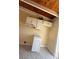 Compact kitchen with white cabinets, marble-look countertops, and essential appliances at 6006 Midnight Pass Rd # 48, Sarasota, FL 34242