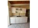 Updated kitchen showcasing white cabinetry and new countertop at 6006 Midnight Pass Rd # 48, Sarasota, FL 34242