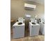 On-site laundry room features modern appliances for residents' convenience at 6006 Midnight Pass Rd # 48, Sarasota, FL 34242