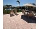 Community pool area with lounge chairs and umbrella-covered table at 6006 Midnight Pass Rd # 48, Sarasota, FL 34242