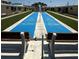 Community shuffleboard area surrounded by condo buildings at 6006 Midnight Pass Rd # 48, Sarasota, FL 34242