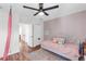Comfortable bedroom featuring an area rug, a ceiling fan, a comfortable bed, and a closet at 6032 36Th E Ct, Ellenton, FL 34222