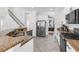 Open kitchen featuring granite countertops, stainless steel appliances, and a view into another living space at 6032 36Th E Ct, Ellenton, FL 34222
