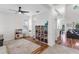 Bright room featuring modern ceiling fan, wood floors, and play area at 6032 36Th E Ct, Ellenton, FL 34222