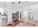 Bright room featuring hardwood floors, play area, and access to bathroom at 6032 36Th E Ct, Ellenton, FL 34222