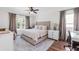 Bright main bedroom with a neutral color palette, a ceiling fan, and an abundance of natural light from the window at 6032 36Th E Ct, Ellenton, FL 34222