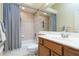 Bathroom featuring a shower and tub combination with a grey and white striped shower curtain at 664 Planters Manor Way, Bradenton, FL 34212