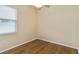 Bedroom with wood floors and natural light from the window at 664 Planters Manor Way, Bradenton, FL 34212