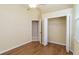 Bedroom with closet, neutral walls, wood floor, and natural light at 664 Planters Manor Way, Bradenton, FL 34212