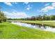 Scenic view of the golf course from the backyard at 664 Planters Manor Way, Bradenton, FL 34212