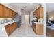 Functional kitchen with modern appliances, generous counter space, and a tiled floor at 664 Planters Manor Way, Bradenton, FL 34212