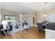 Open-concept living area showcasing stylish furnishings, hardwood floors, and ample natural light at 664 Planters Manor Way, Bradenton, FL 34212
