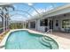 Beautiful pool and outdoor space, complete with a screened enclosure, patio and access to indoor/outdoor living at 664 Planters Manor Way, Bradenton, FL 34212