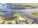 Aerial view of the community with waterfront, marina, swimming pool and luxurious residential buildings at 706 Misty Pond Ct, Bradenton, FL 34212
