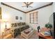 Neutral bedroom with a daybed, desk, and light hardwood floors at 706 Misty Pond Ct, Bradenton, FL 34212