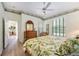 Comfortable bedroom with a tropical-themed bedspread and ample natural light at 706 Misty Pond Ct, Bradenton, FL 34212