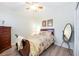 Bedroom with wood floors and neutral walls, bright natural light at 706 Misty Pond Ct, Bradenton, FL 34212