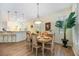 Elegant dining room featuring a wooden table set and modern pendant lighting at 706 Misty Pond Ct, Bradenton, FL 34212