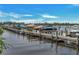 View of a long, wooden community dock with multiple boats secured in their slips at 706 Misty Pond Ct, Bradenton, FL 34212