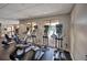 Bright gym area featuring modern cardio machines, with exterior windows with views of the pool at 706 Misty Pond Ct, Bradenton, FL 34212