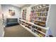 Cozy library space with well-stocked bookshelves, seating, and good lighting at 706 Misty Pond Ct, Bradenton, FL 34212